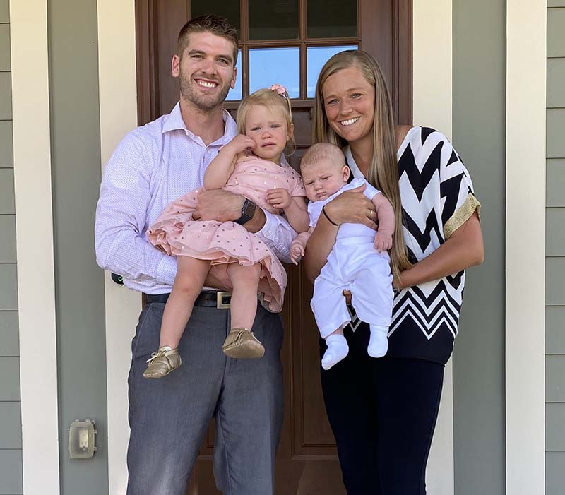 dr brad boyle with his wife and two children